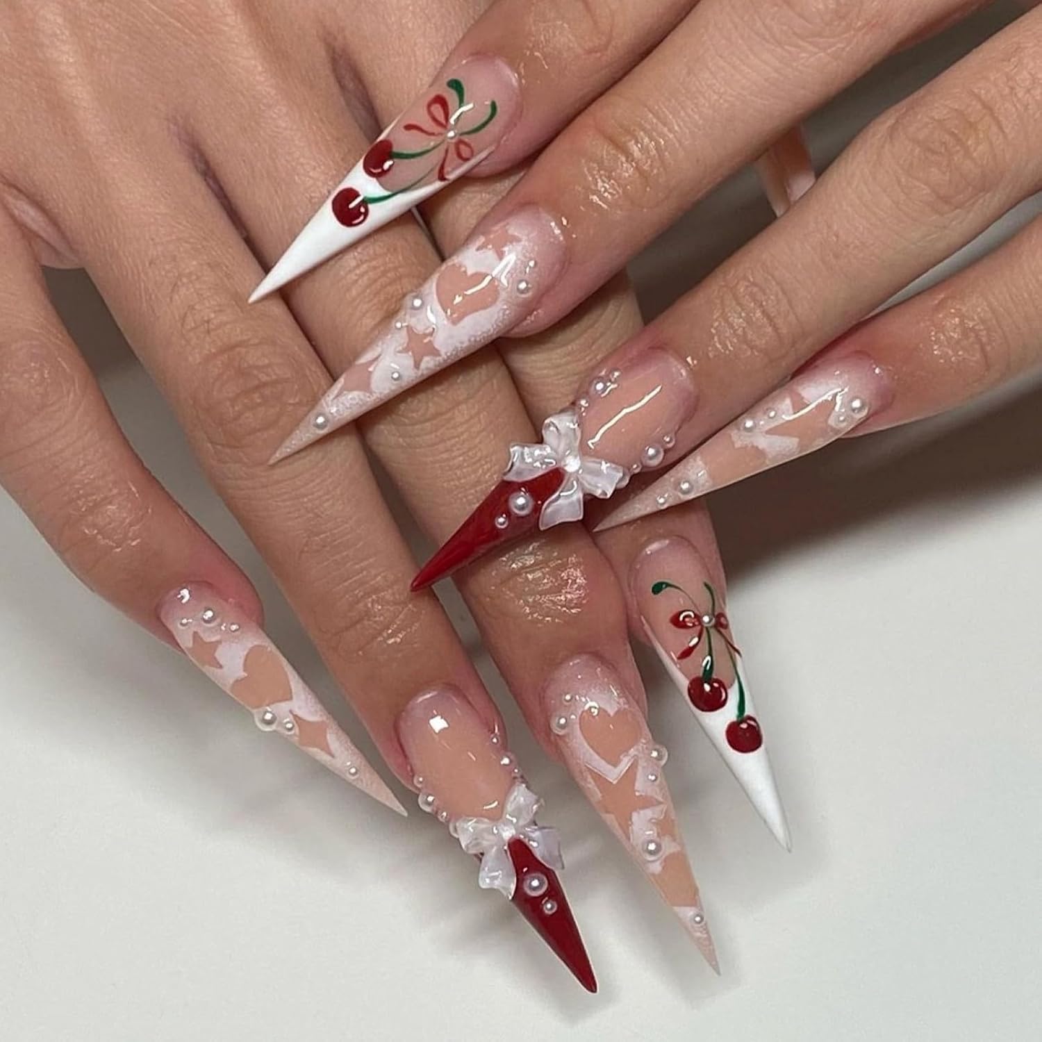 French tip Press on Nails Long Stiletto Fake Nails with 3D Bow Charm Design Cherry Glue on Nails Star Heart Stick on Nails White Red False Nails Reusable Acrylic Nails for Women Girls Manicure 24pcs